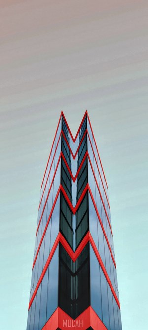 Modern building with red accents against sky