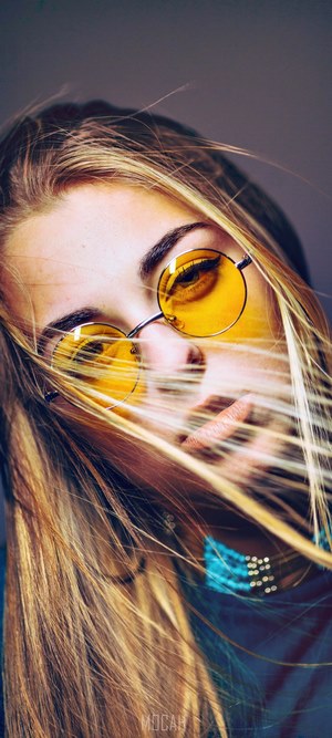 Emilie wearing yellow sunglasses