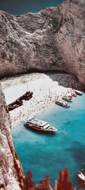 Navagio Shipwreck Beach with Tourists and Boats
