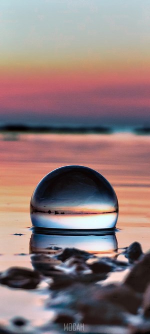 Serene Sunset Reflection in Crystal Sphere