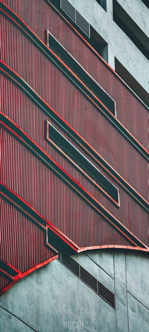 Modern building facade with red and gray panels