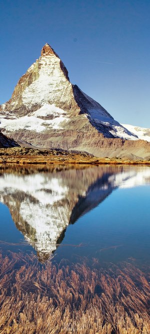 Matterhorn mountain reflected in a calm lake
