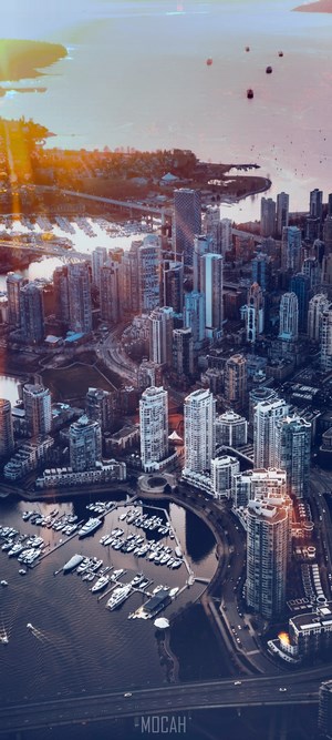 Aerial view of Vancouver cityscape with marina at sunset