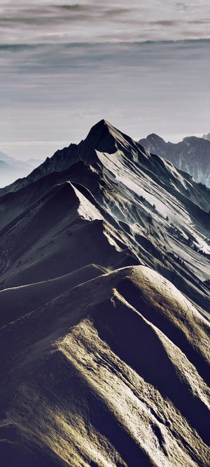 Augstmatthorn mountain range under a cloudy sky
