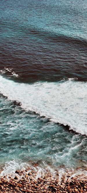 Ocean waves crashing on a rocky shore