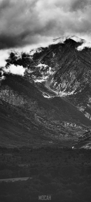 Black and white mountain landscape with clouds