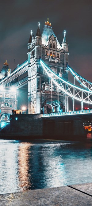 Tower Bridge illuminated at night over the River Thames
