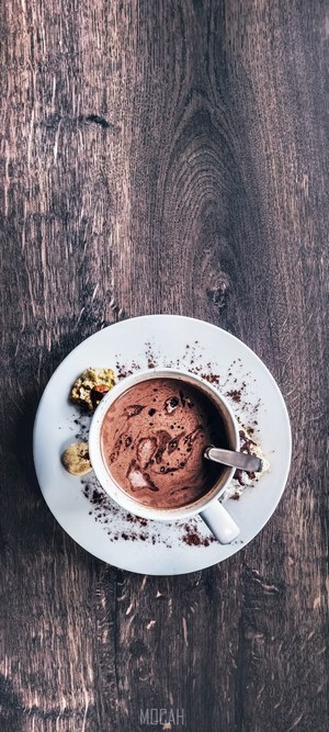 Hot chocolate with cookies on a wooden table
