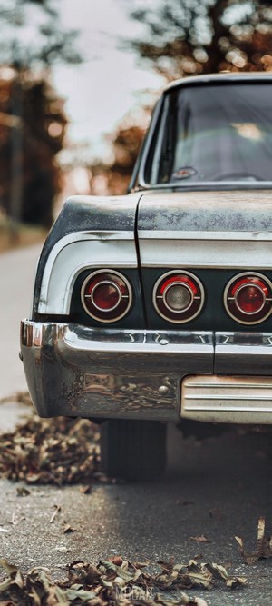 Rear view of a classic Chevrolet Impala with round taillights
