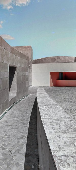 Modern architecture with stone walls and courtyard
