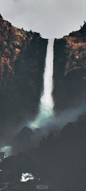 Waterfall cascading down rocky cliffs
