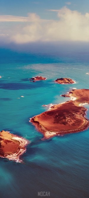 Aerial view of Isles of Scilly in clear blue water