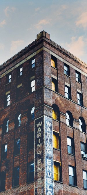 Corner of a brick warehouse building with windows