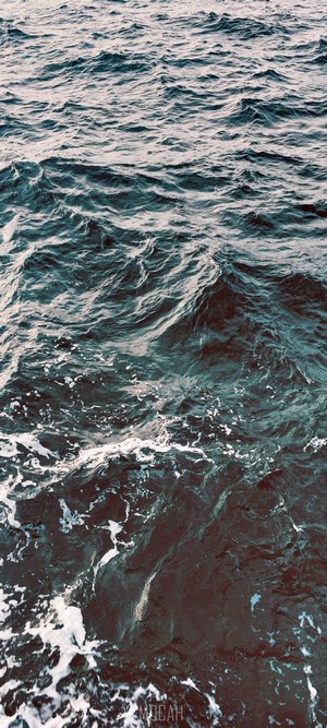 Ocean waves with white foam
