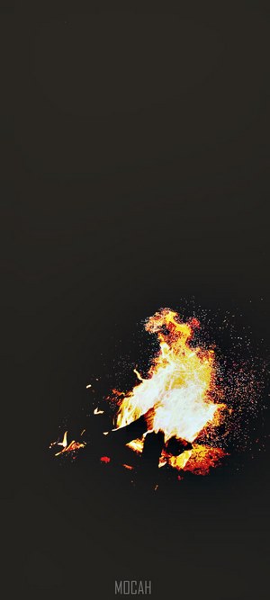 Campfire with sparks at night