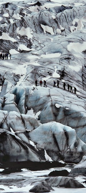 People hiking on a glacier in Iceland