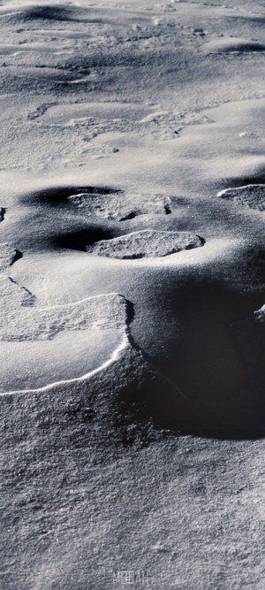 Snowy terrain with shadows and light
