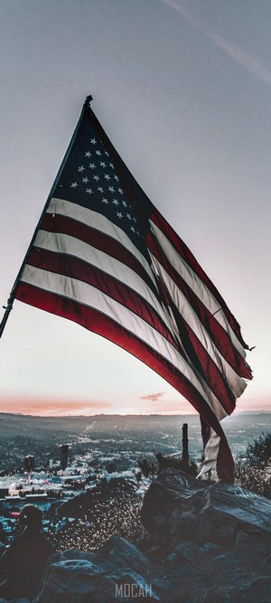 American flag over Los Angeles at sunset