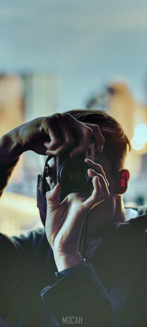 Man taking a selfie with a camera