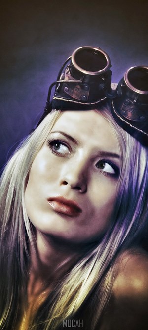 Woman with aviator goggles looking up