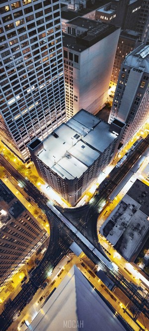 Aerial view of Chicago skyscrapers and train tracks at night