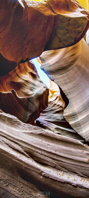 Antelope Canyon rock formations against blue sky