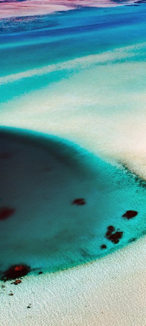 Abstract aerial view of turquoise water and sand