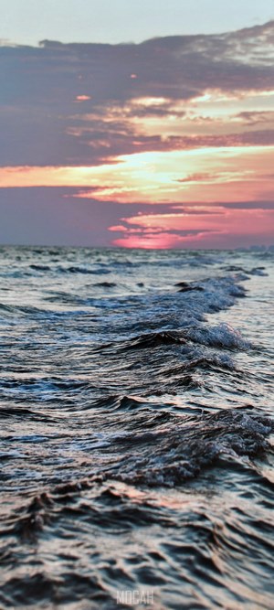Ocean waves at sunset