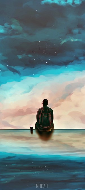 Person with backpack sitting by the water at sunset