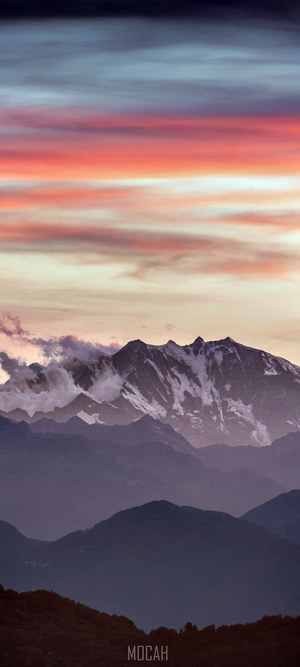 Mountain range at sunset with colorful clouds