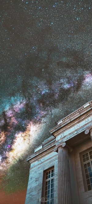 Milky Way galaxy over classical building with columns
