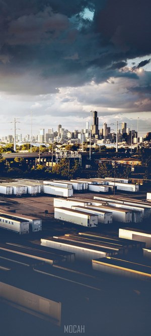 Cityscape with Trailers and Stormy Clouds