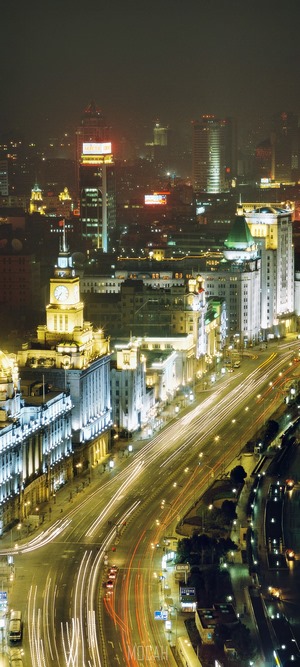 Night view of Shanghai Bund with traffic trails