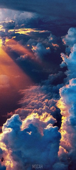 Sunbeams through clouds at sunset