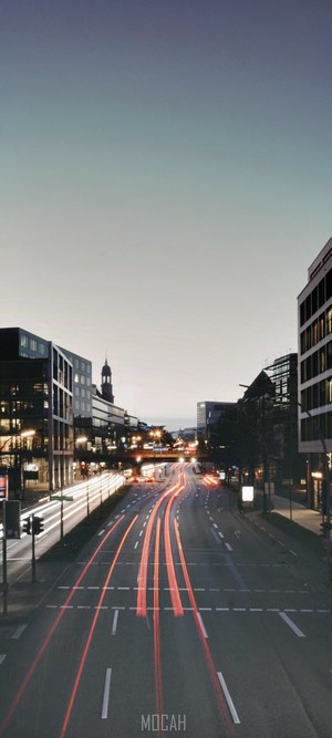 City street with light trails at dusk