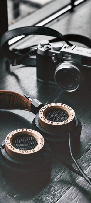 Grado RS2e Headphones and Camera on Wooden Surface
