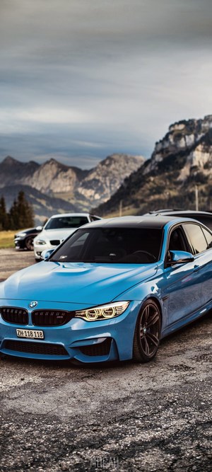 Blue BMW M3 Sports Car with Mountain Background