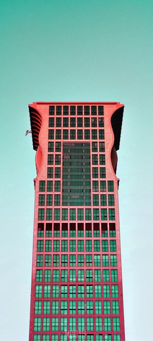Red skyscraper with turquoise sky