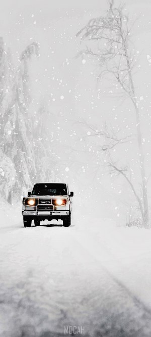Toyota Land Cruiser driving in snow