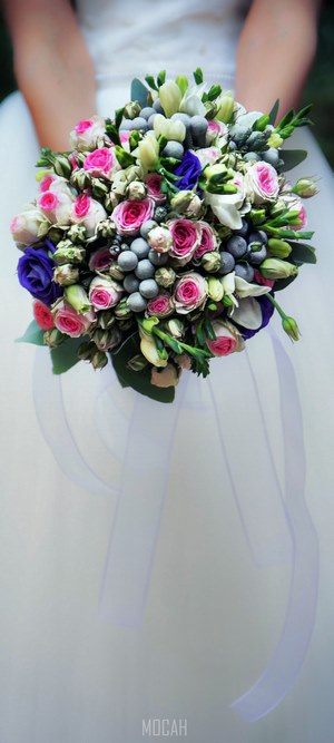 Bride holding a magnificent bridal bouquet