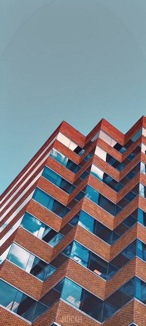 Zigzag brick building with blue windows