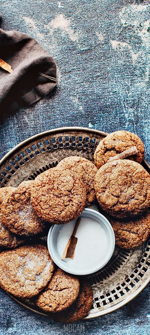 Spiced cookies on a decorative tray with sugar