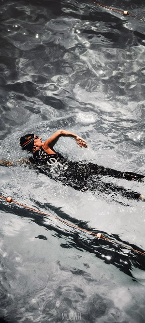 Man swimming freestyle in a pool