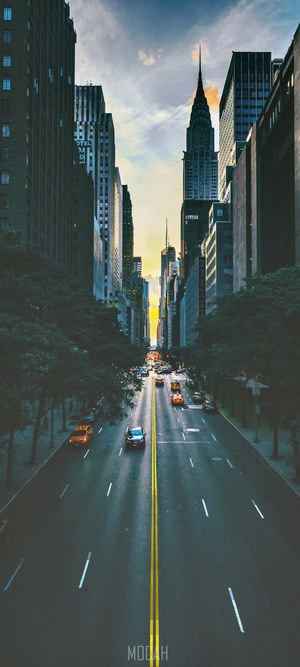 New York City street with Chrysler Building at sunset
