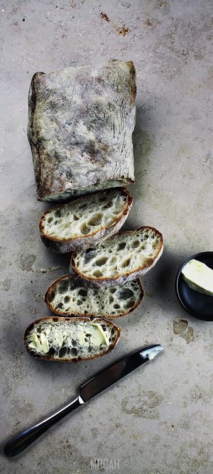 Ciabatta bread with butter and knife
