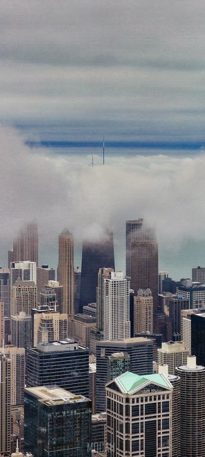 Chicago skyscrapers shrouded in fog with antennas