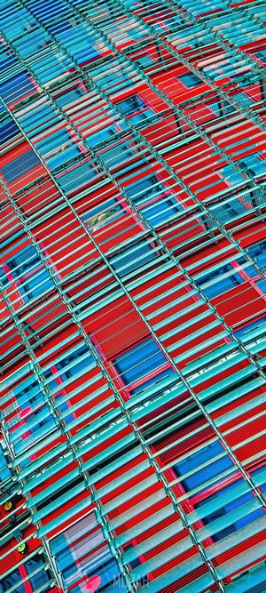 Red and blue striped pattern with metal grid