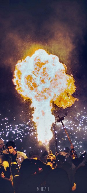 Explosion of fire and sparks over a crowd