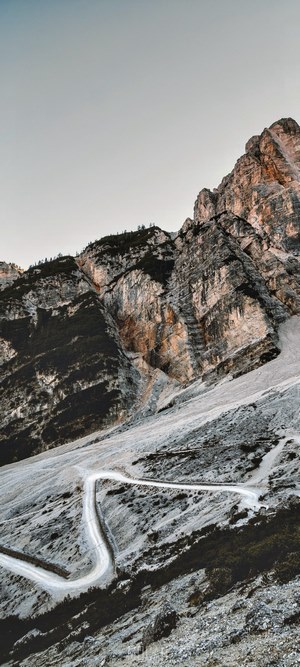 Curvy mountain road with rocky peaks