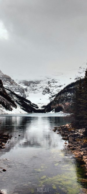 Lake Louise with snow-capped mountains and reflection